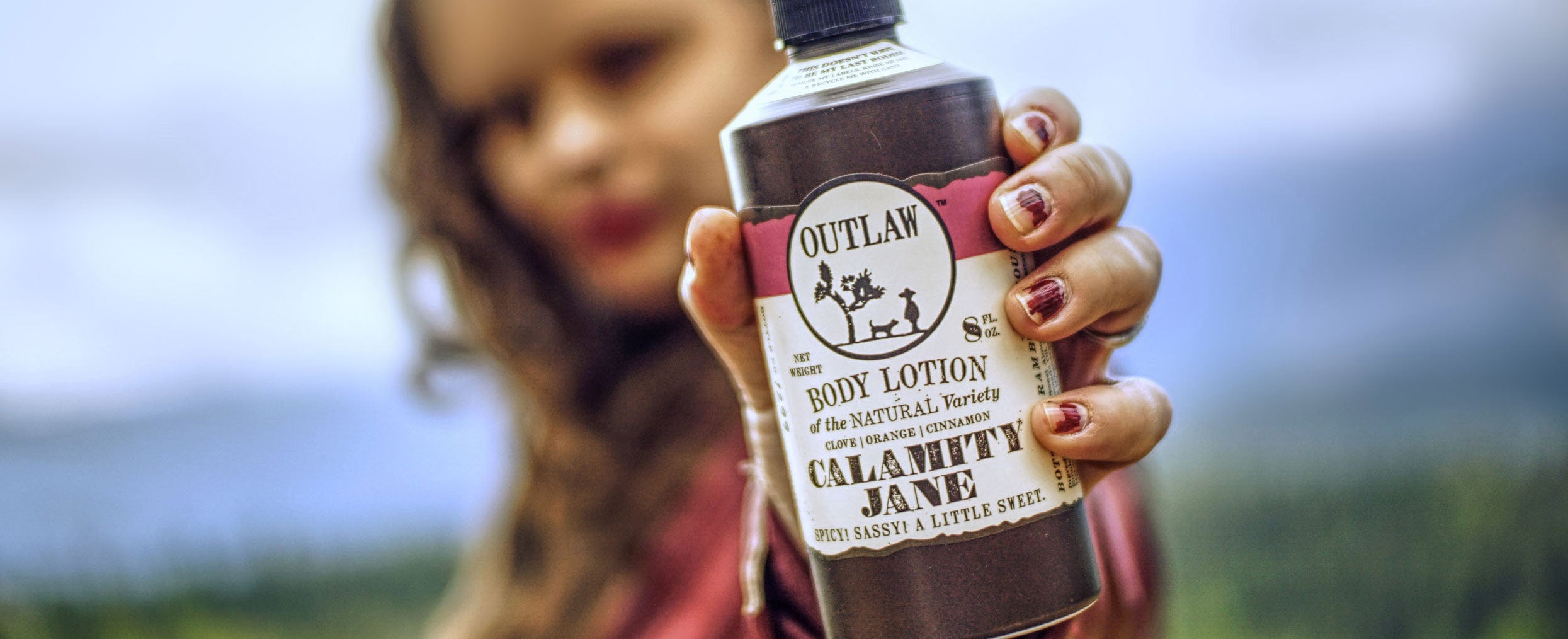 http://liveoutlaw.com/cdn/shop/collections/Outlaw-Calamity-Jane-Clove-Natural-Lotion-clove-orange-cinnamon-whiskey-outdoors-hand-web-resolution.jpg?v=1669669959