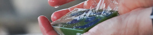 A close-up of Danielle's hands with a bar of Home on the Range soap