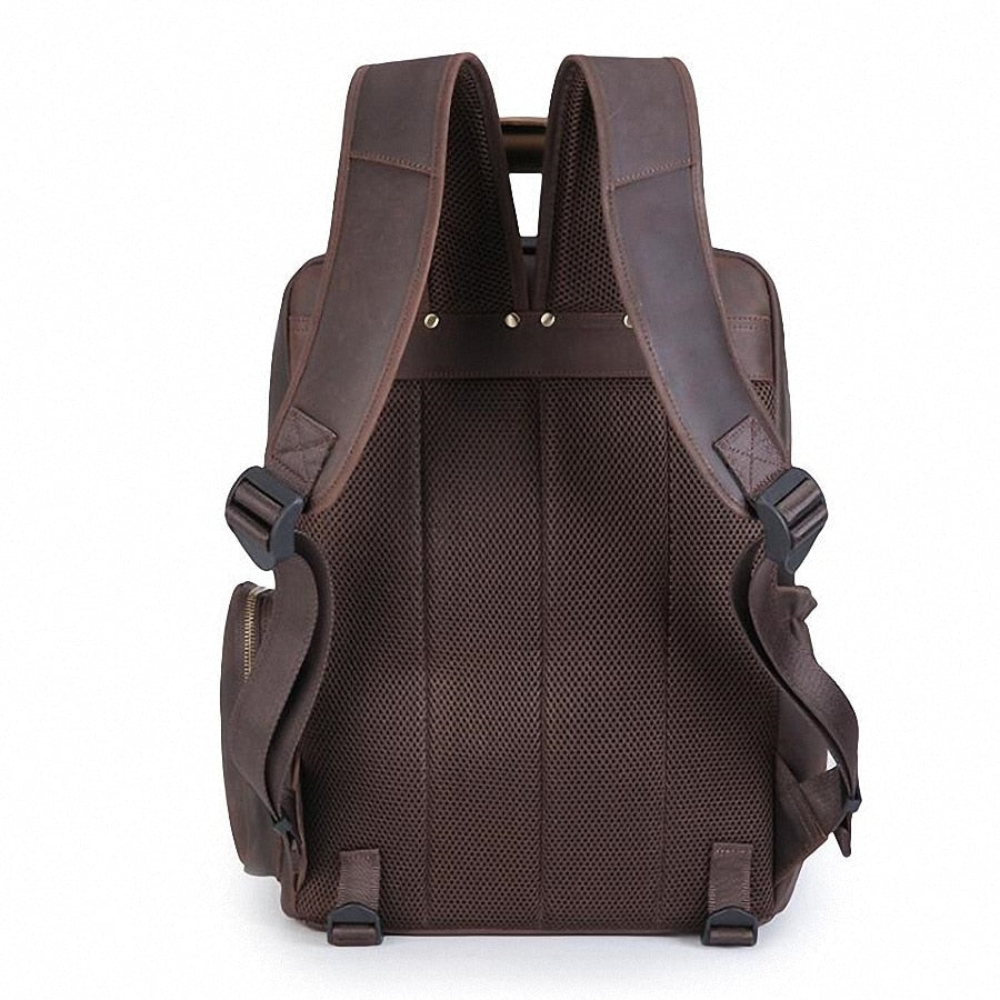 The Gaetano Large Leather Backpack Camera Bag with Tripod Holder, featuring adjustable straps, rugged leather, and compartments for camera gear and a laptop.