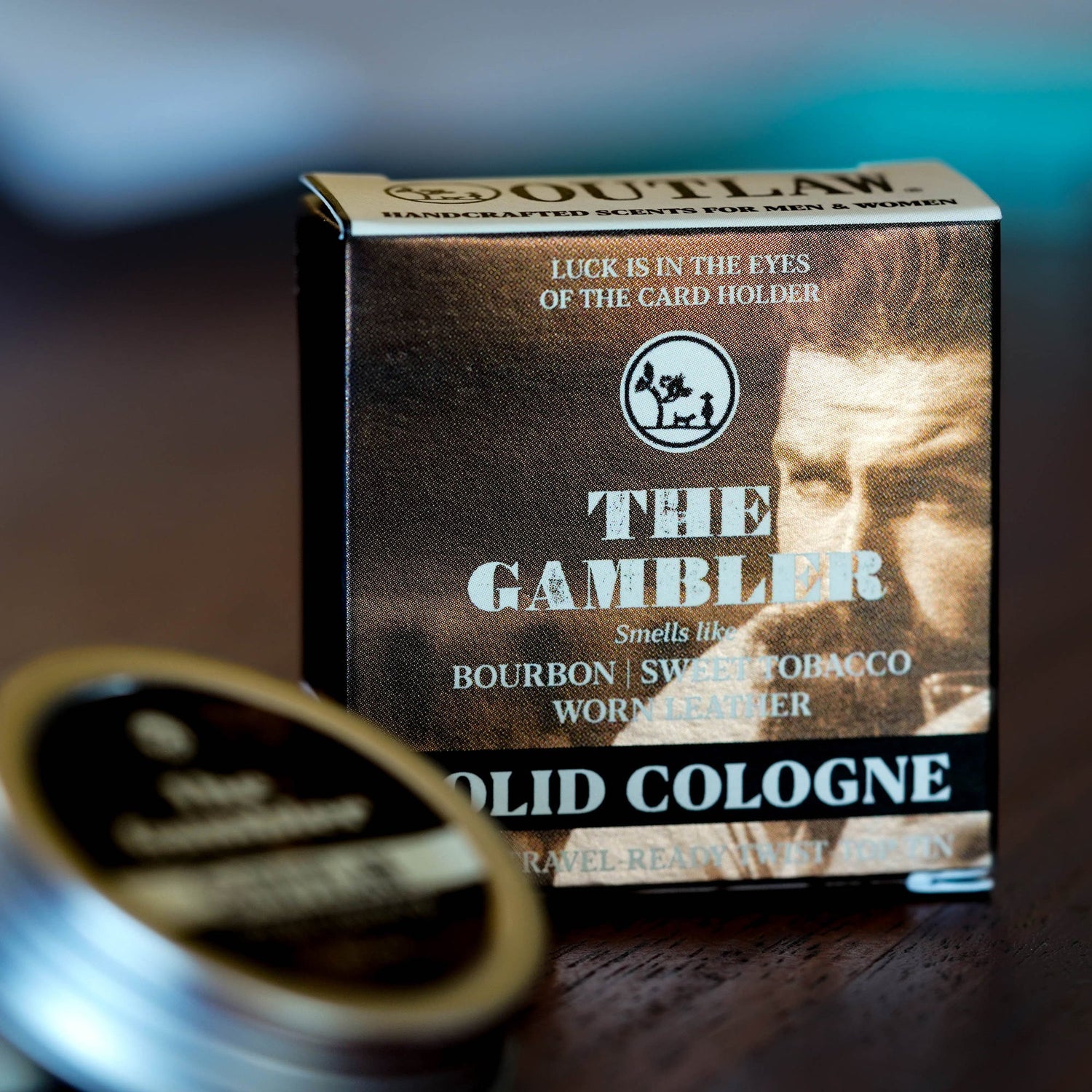 Box of Craft Your Own The Gambler Scent Soundtrack featuring notes of bourbon, tobacco, and leather on a table, embodying skill and charm.