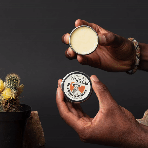 Solid cologne with Blazing Saddles leather scent by Outlaw