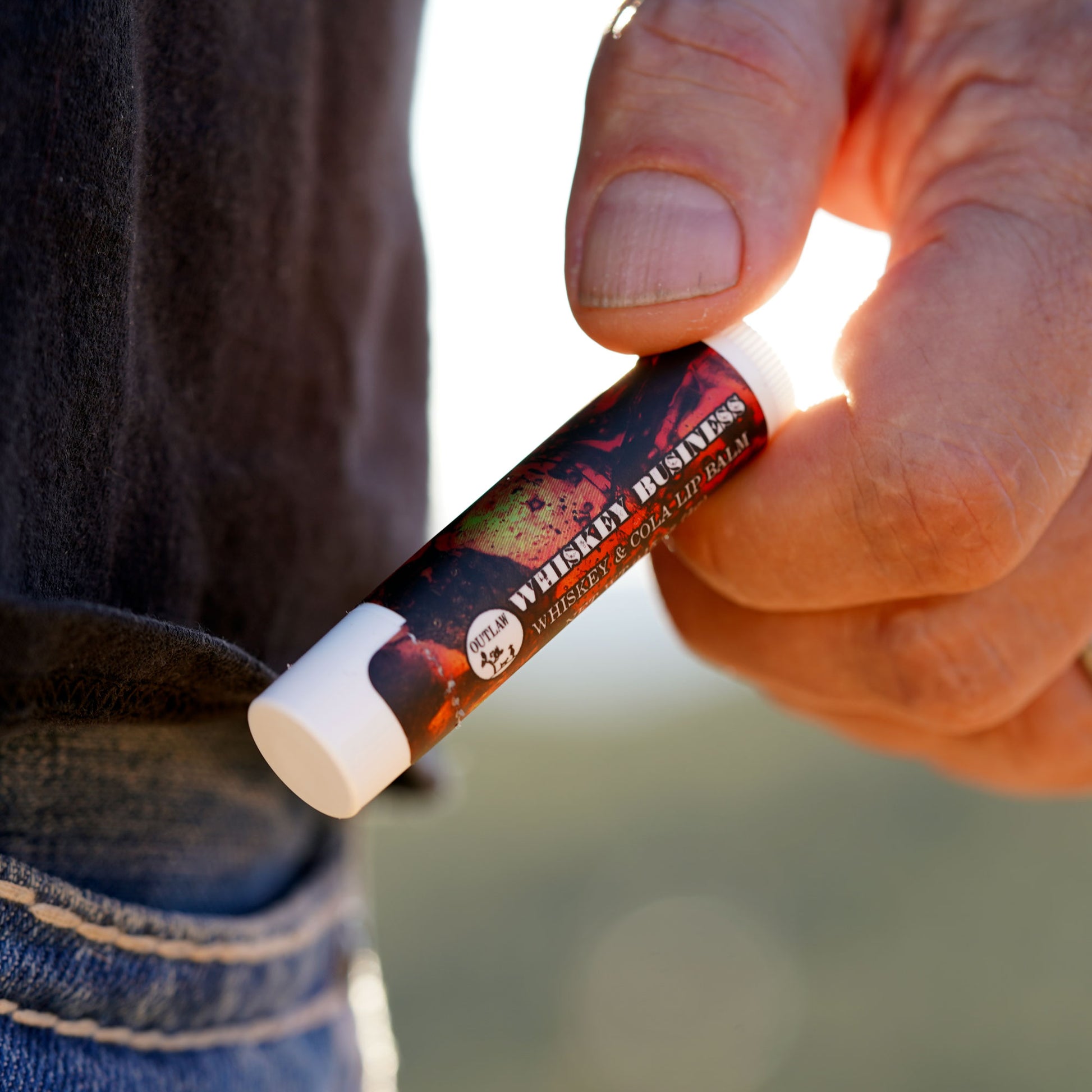 Outlaw whiskey business lip balm tastes like whiskey and cola